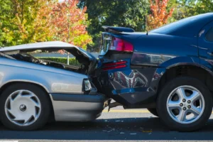 A rear-end car accident collision.