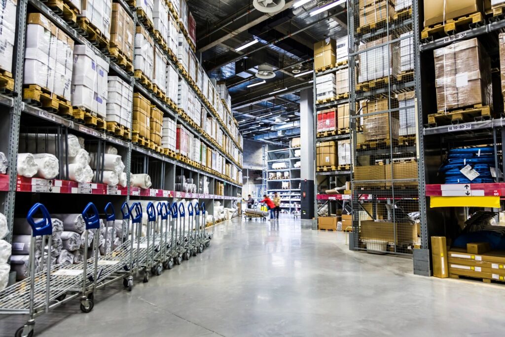 A wholesale grocery store with shelves filled with boxes, ready to fall.